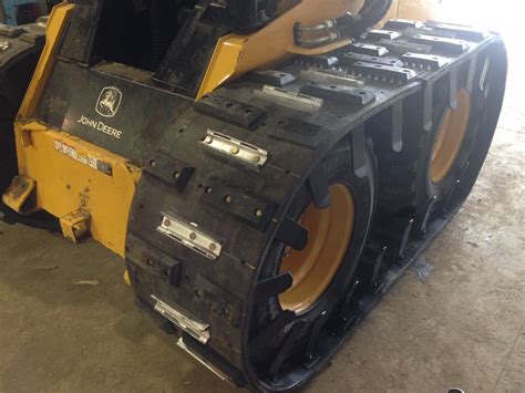 ice cleats for skid steer tracks|chains for tracks.